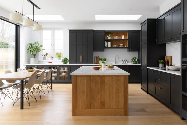 This open-plan shaker-style kitchen blends practical design elements with modern elegance (Higham Furniture/PA)