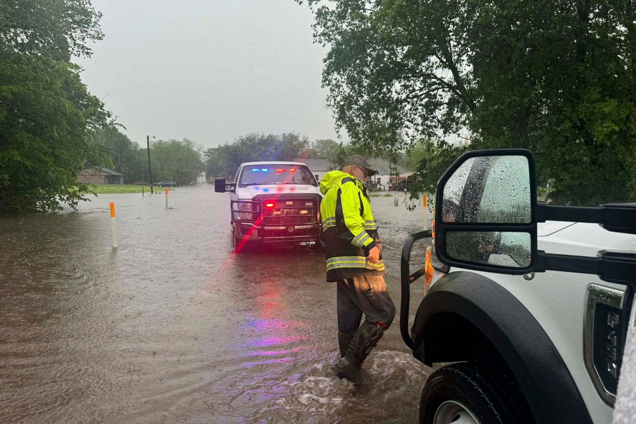 Emergency workers have been helping stranded drivers trapped in flood water