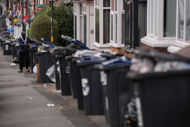Bins have been overflowing in Birmingham since an all-out strike was launched by bin workers on March 11 (Jacob King/PA)