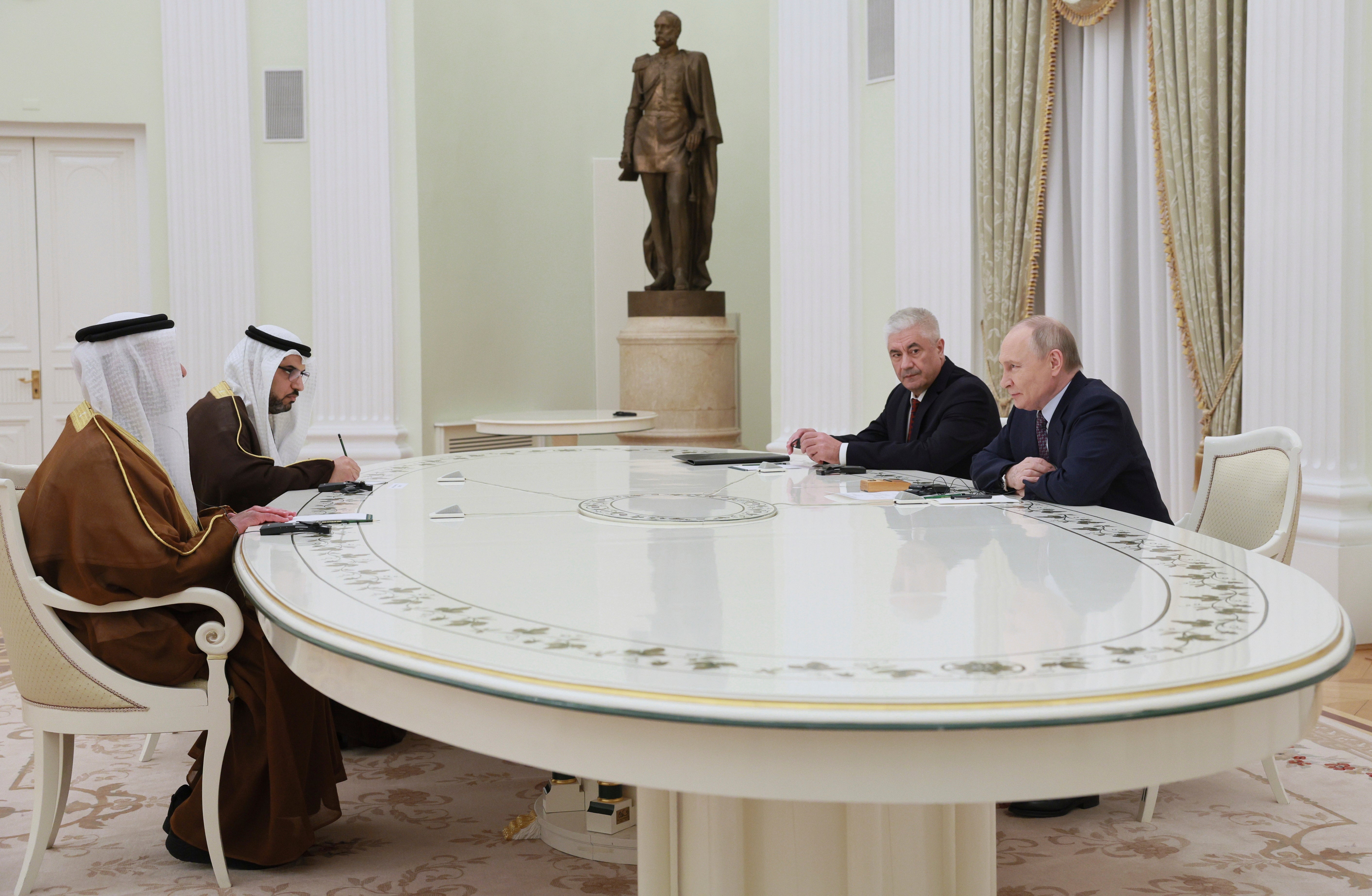 Russian President Vladimir Putin, right, and Russian Interior Minister Vladimir Kolokoltsev, second right, attend talks with UAE Deputy Prime Minister and Minister of Interior Sheikh Saif bin Zayed Al Nahyan, left, at the Kremlin in Moscow