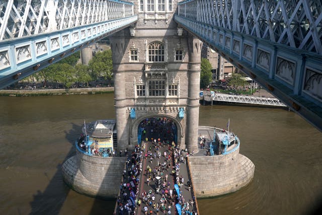 The mass participation race on Tower Bridge during the TCS London Marathon (Jonathan Brady/PA)