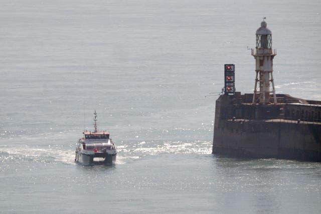A group of people thought to be migrants are brought in to Dover on board a Border Force vessel on Thursday (Gareth Fuller/PA)