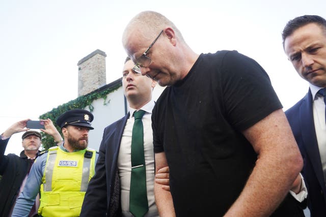 Richard Satchwell (second right) arriving at the District Court in Cashel, Co Tipperary, after being charged in connection with the murder of his wife Tina Satchwell (Brian Lawless/PA)