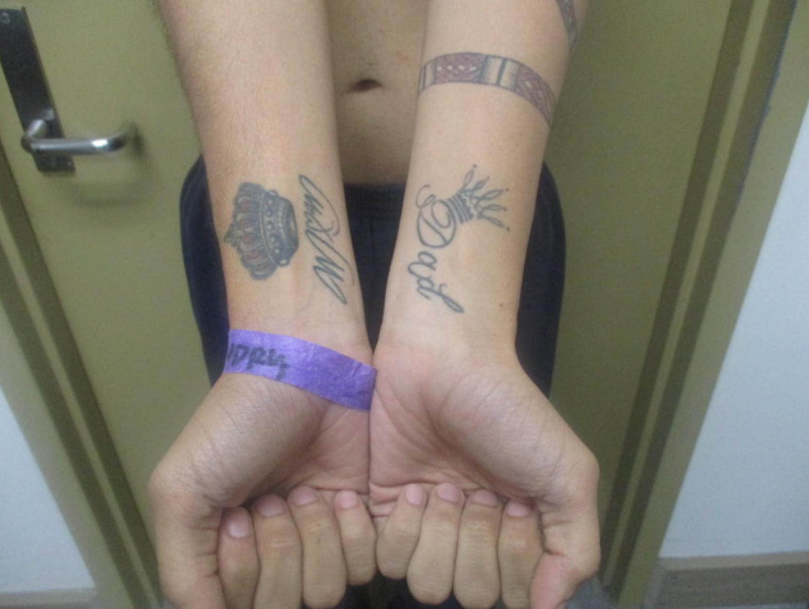 A photograph of Andry Jose Hernandez Romero's tattoos while in ICE custody and submitted in court filings show the words 'mom' and 'dad' on each arm with crowns above them