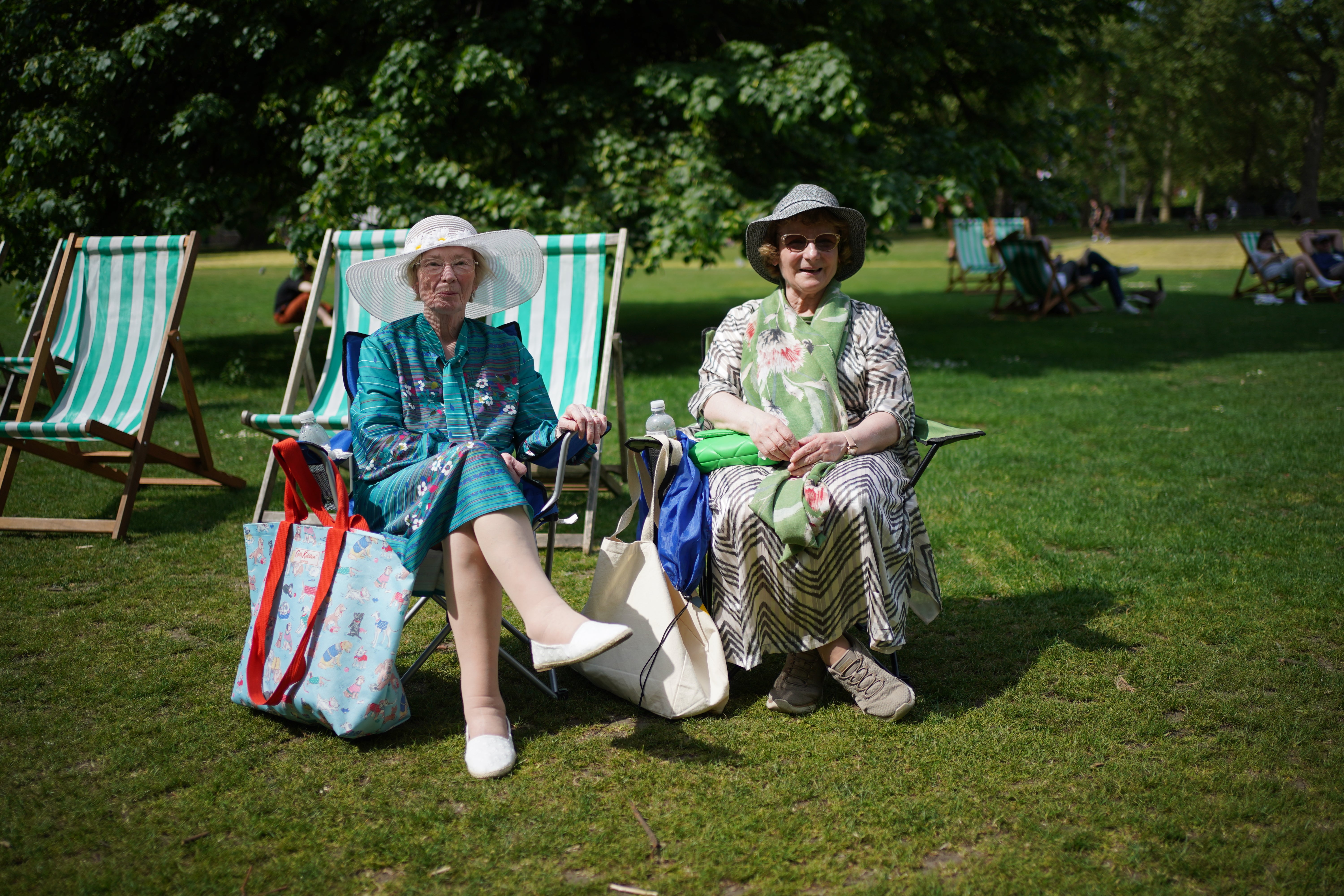People enjoy the warm weather in St James's Park, London, on Thursday