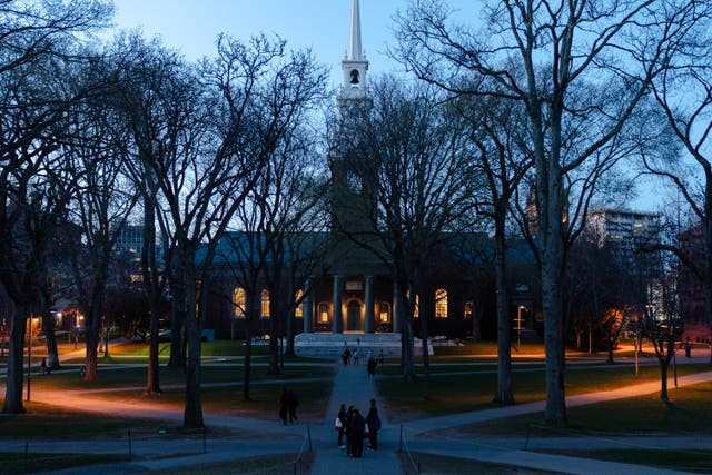 <p>People cross the Harvard Yard at Harvard University on April 17, 2025, in Cambridge, Massachusetts</p>