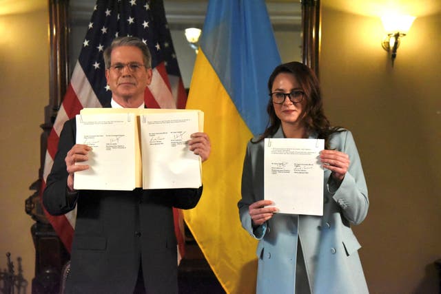 <p>US treasury secretary Scott Bessent and Ukrainian economy minister Yulia Svyrydenko pose after signing the deal</p>