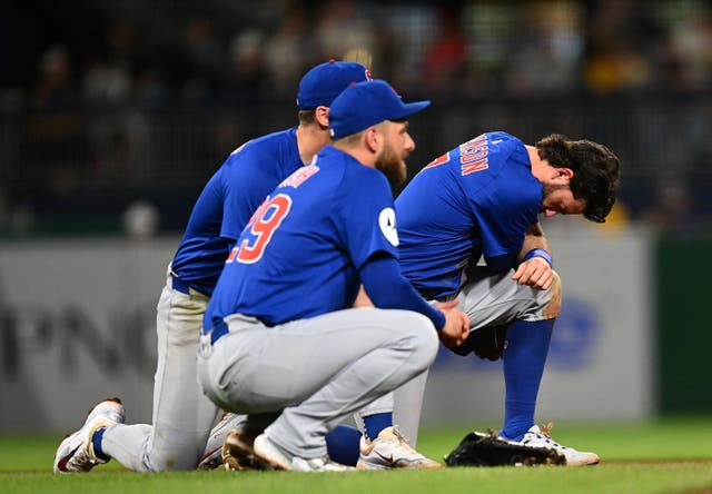 <p>Players look on after the fall during the game on Wednesday night</p>