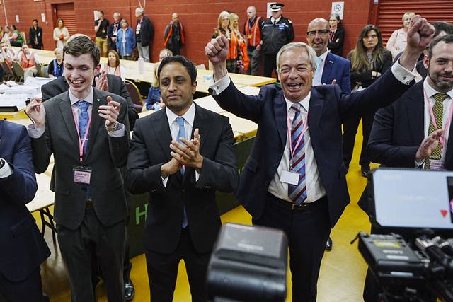 Reform UK leader Nigel Farage (right) and chairman Zia Yusuf (centre) celebrate after Reform candidate Sarah Pochin won the Runcorn and Helsby by-election (Peter Byrne/PA)