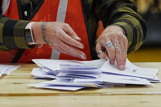 Votes are counted at DCBL Halton Stadium, Widnes, Cheshire, for the Runcorn and Helsby by-election (Peter Byrne/PA)