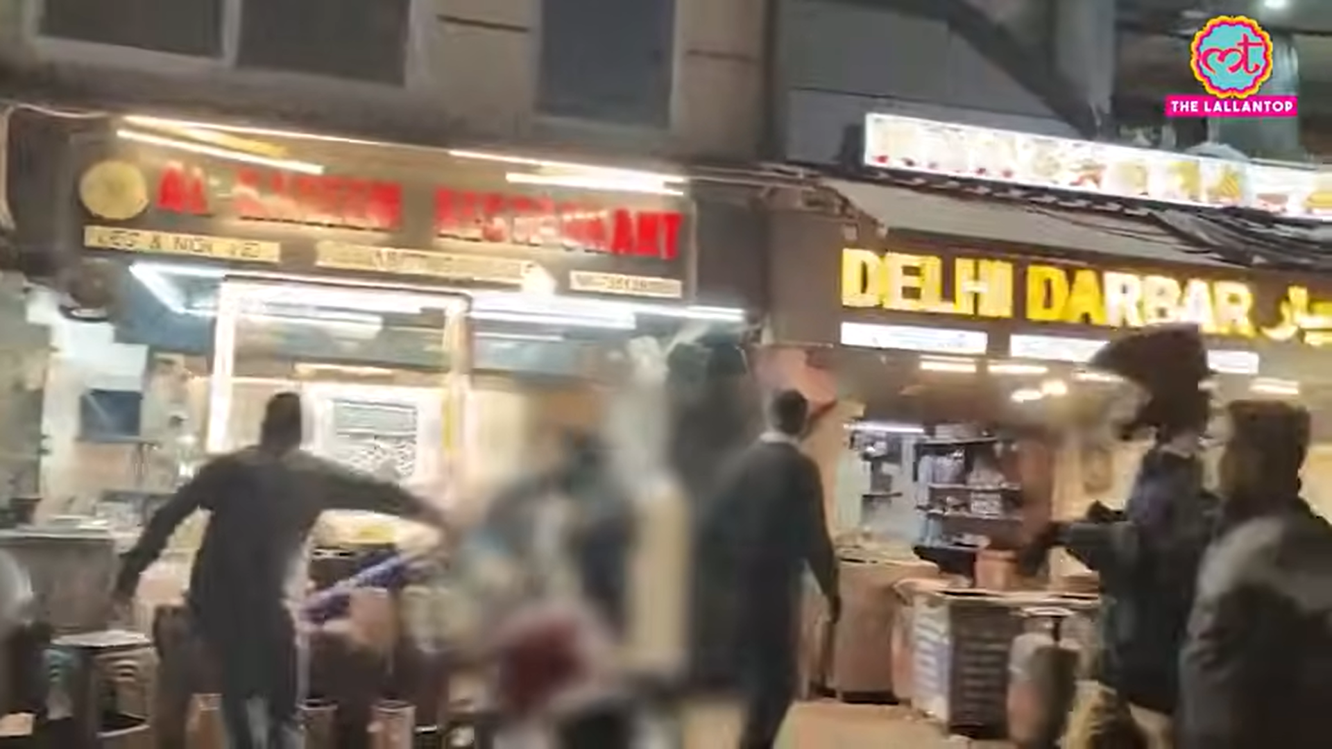 <p>People vandalise shops in Nainital, India</p>