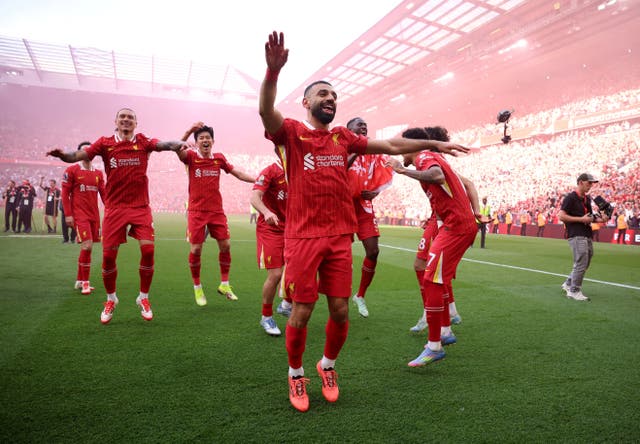 <p>Liverpool's Mohamed Salah and teammates celebrate after winning the Premier League</p>