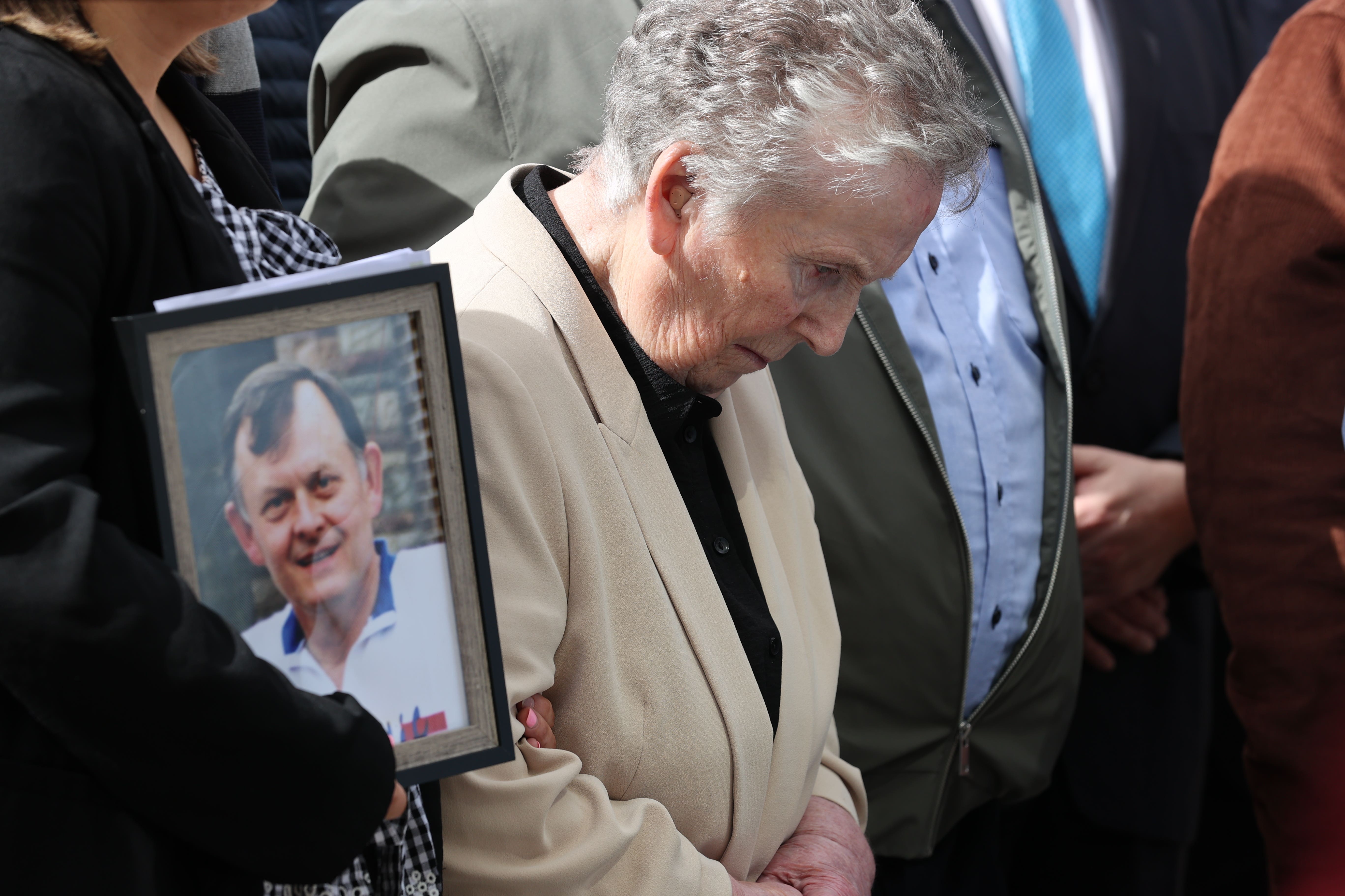 Supporters of the family of GAA official Sean Brown with widow Bridie Brown outside Belfast’s Court of Appeal (Liam McBurney/PA)