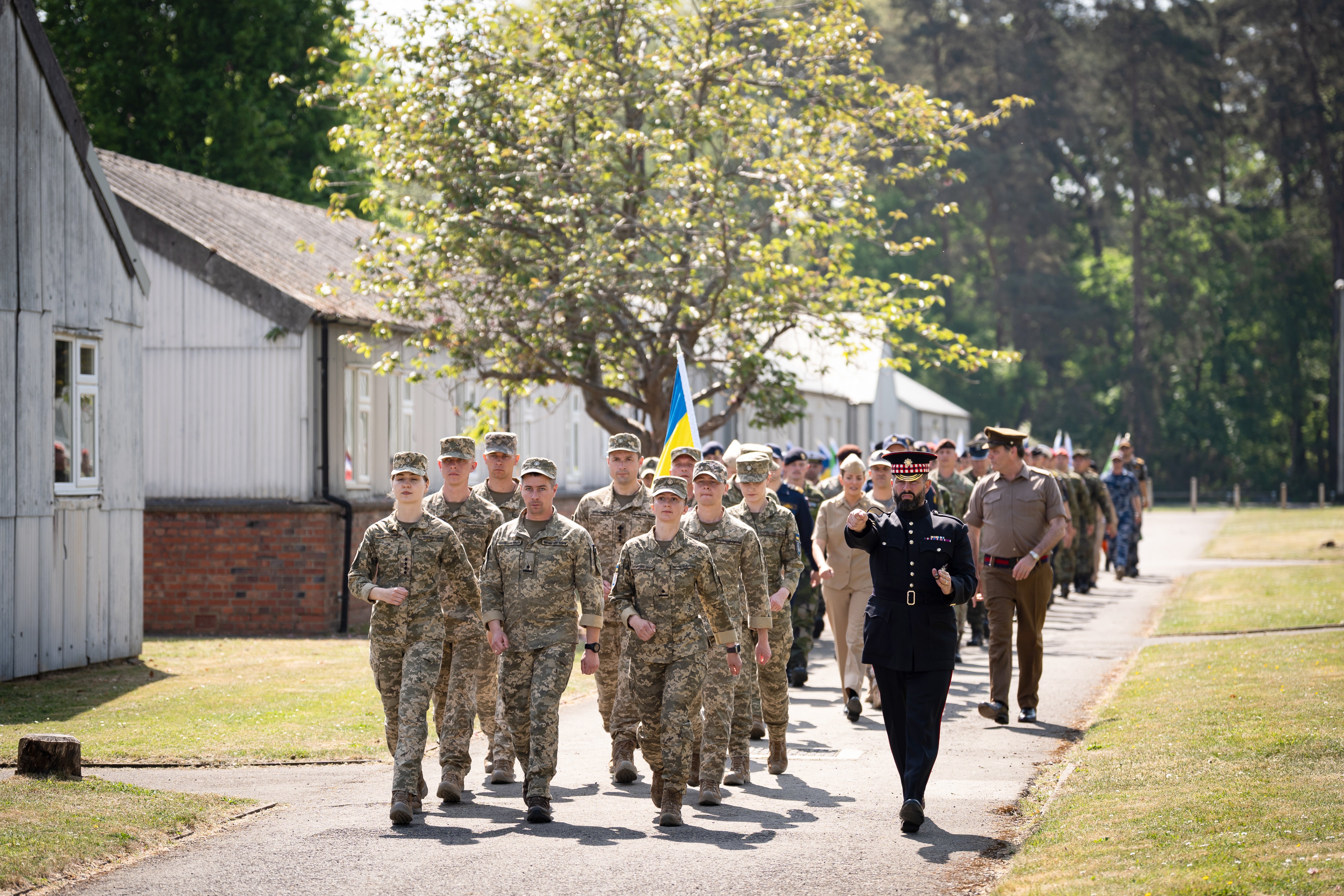 Members of the Ukrainian Armed Forces taking part in a procession rehearsal in preparation for the VE Day 80th Anniversary on May 5, at Army Training Centre Pirbright in Woking, Surrey.