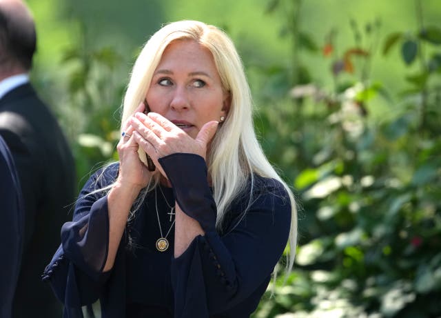 <p>U.S. Rep. Marjorie Taylor Greene (R-GA) talks on the phone during a National Day of Prayer event hosted by President Donald Trump in the Rose Garden at the White House on May 1, 2025 in Washington, DC</p>