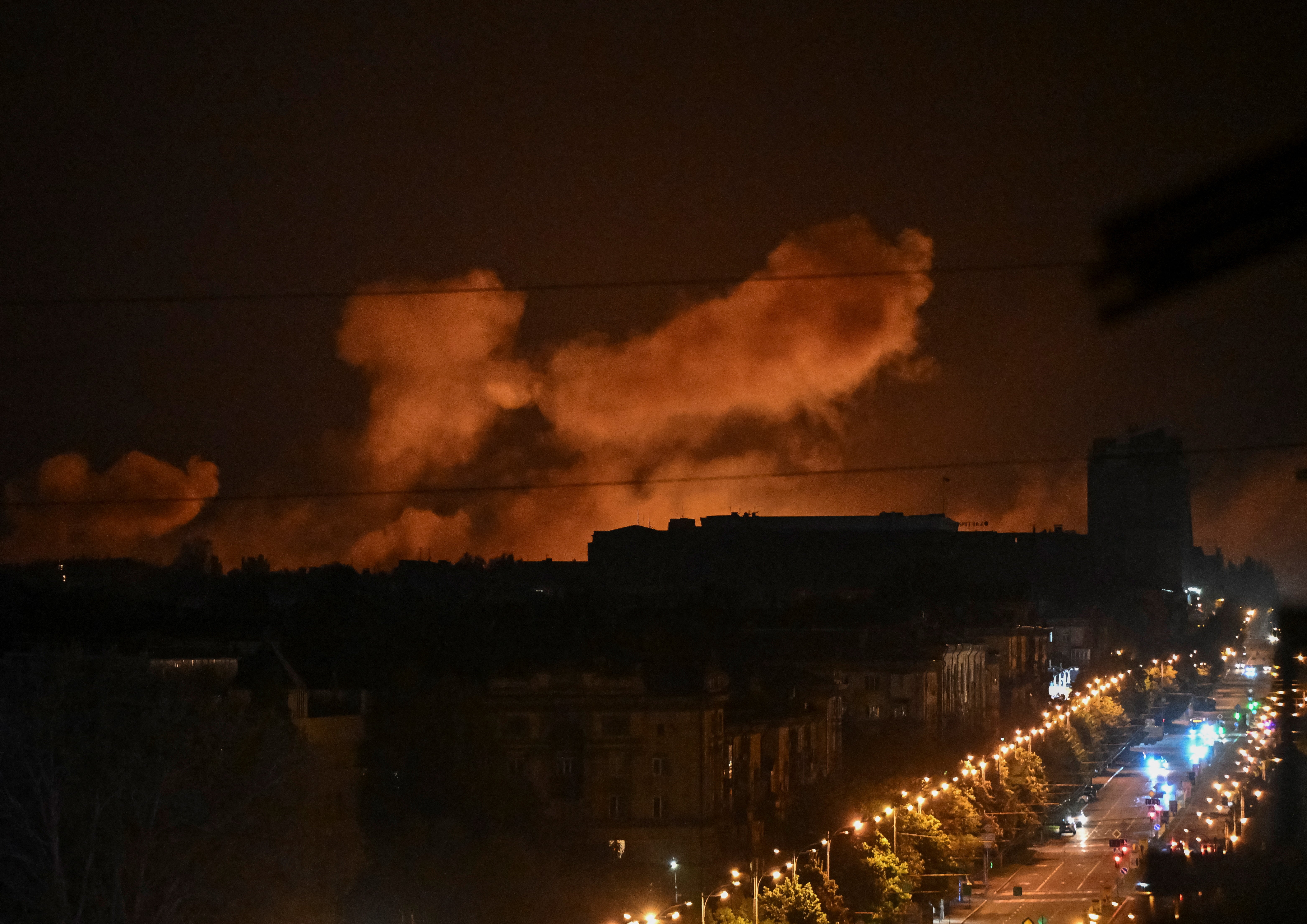 Smoke rises in the sky over the city after a Russian drone strike