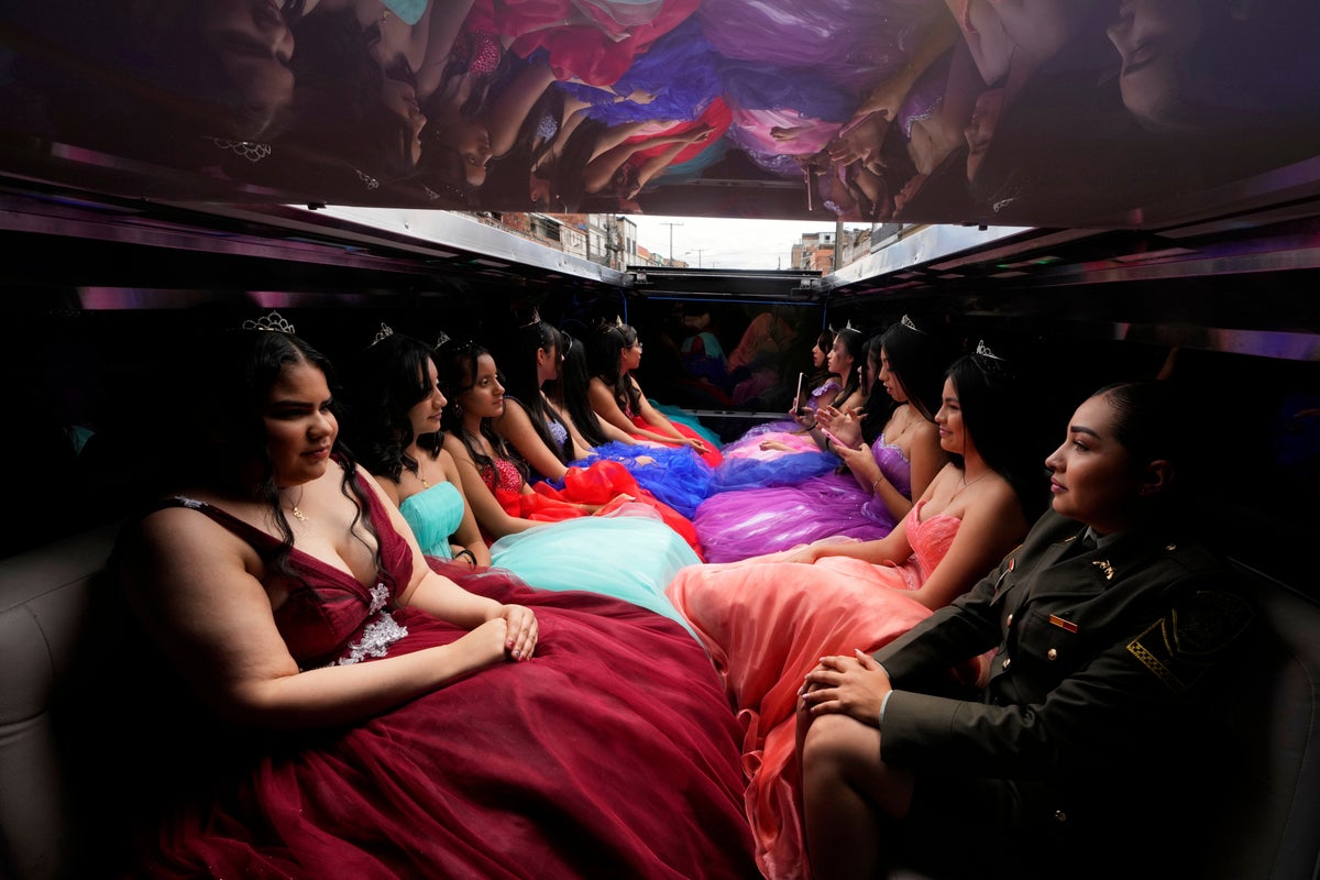AP PHOTOS: Colombian quinceañeras see dream come true with the support of many, including the police