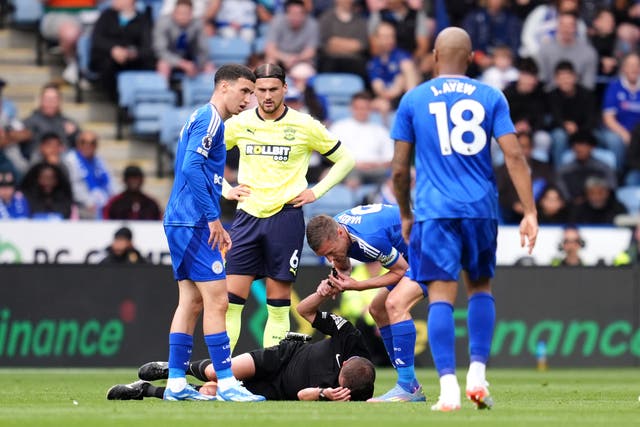 <p>Jamie Vardy blows David Webb's whistle after the official suffered a head injury</p>
