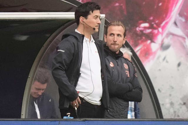 Harry Kane, right, stands on the sidelines (Matthias Schrader/AP)