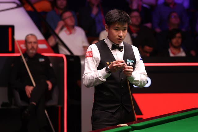 <p>Zhao Xintong takes centre stage at the Crucible on Sunday</p>