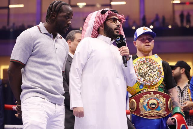 <p>Terence Crawford (left) enters the ring before facing off with Canelo</p>