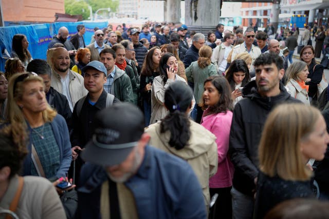 <p>Travelers wait for news about their delayed trains at the Madrid train station, Spain, Monday, May 5, 2025. (AP Photo/Manu Fernandez)</p>