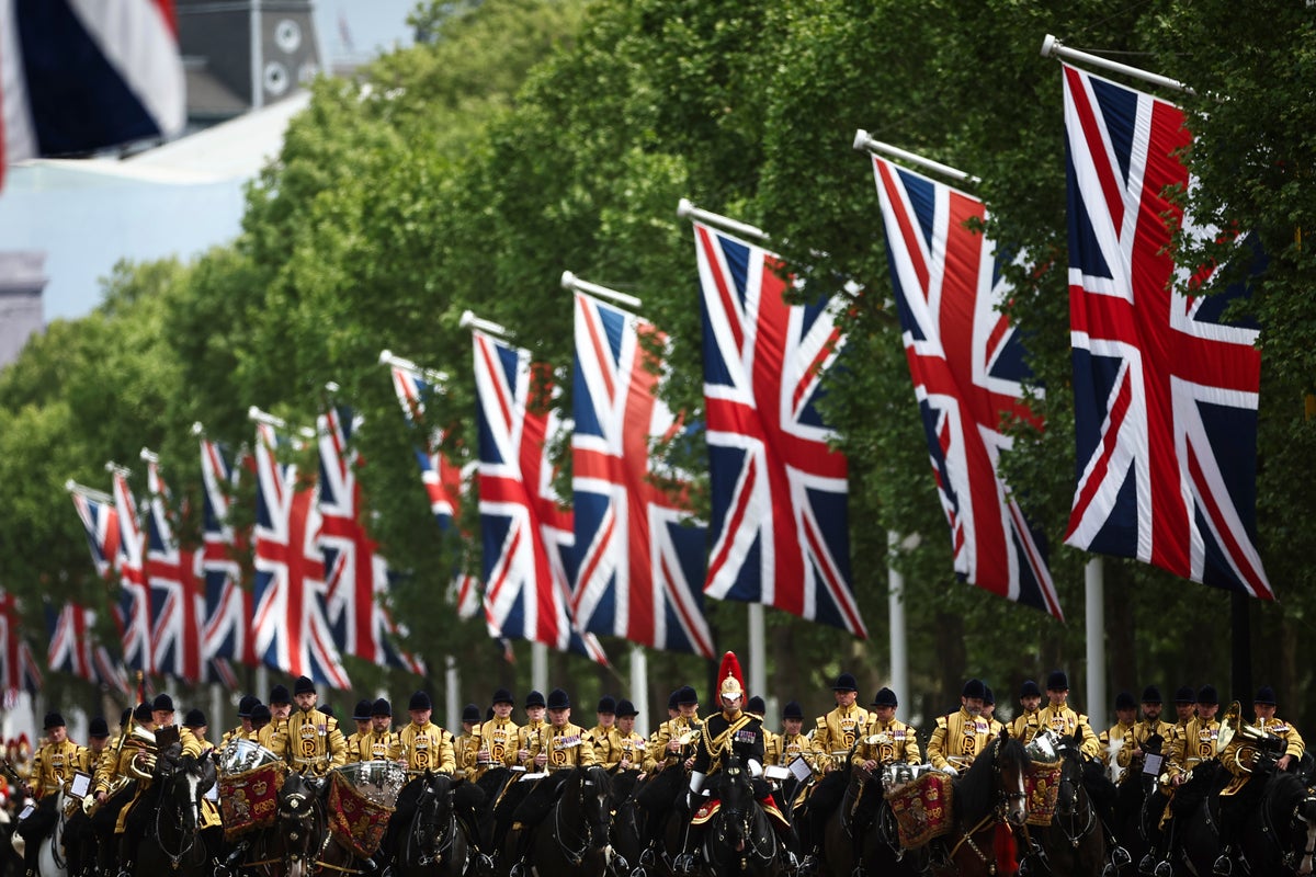 Thousands of people gather near Buckingham Palace to mark the 80th anniversary of V-E Day