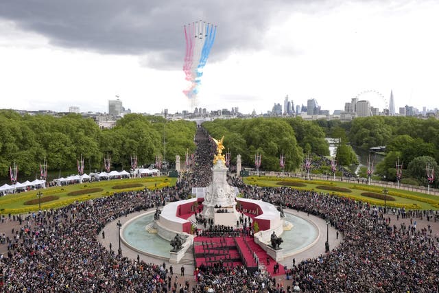 The military flypast passes over The Mall and Buckingham Palace (Andrew Matthews/PA)