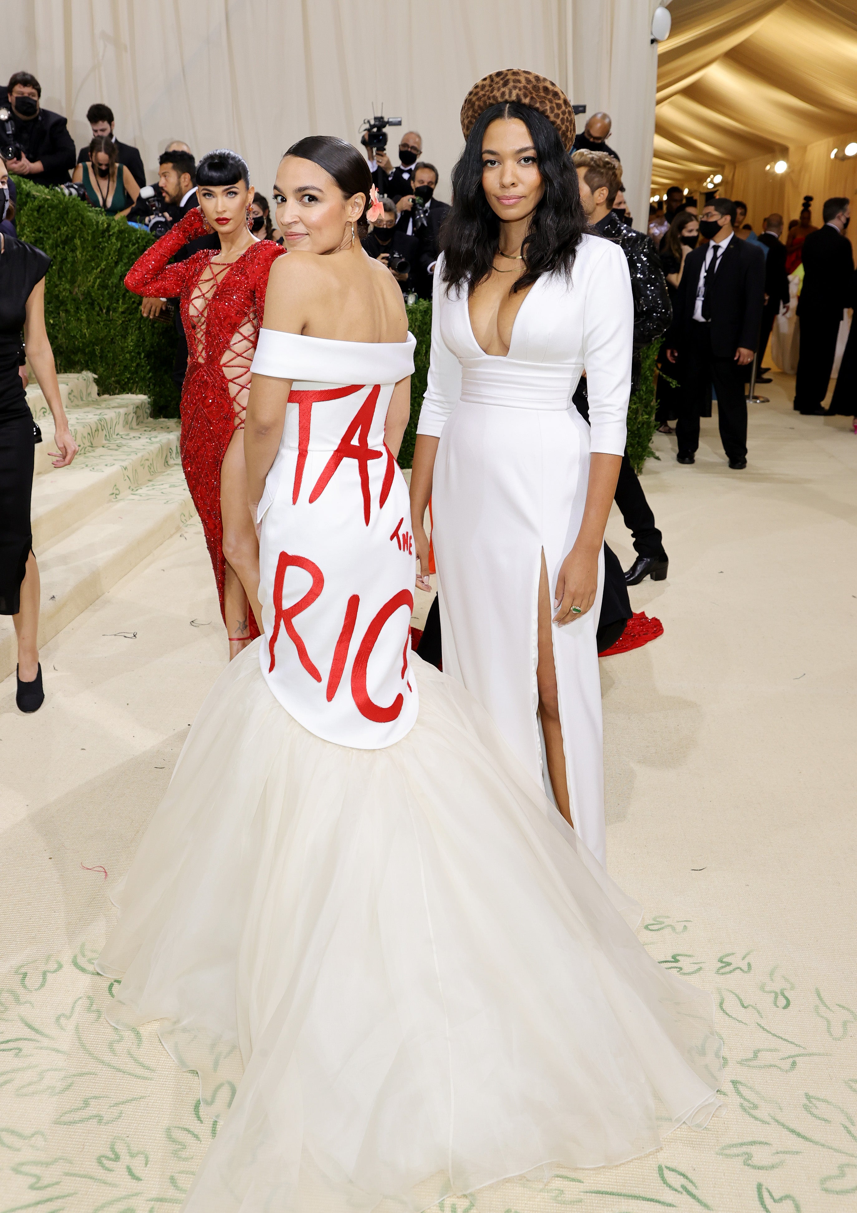Alexandria Ocasio-Cortez wore a white dress with “Tax the Rich” painted across to the 2021 Met Gala, “In America: A Lexicon of Fashion”