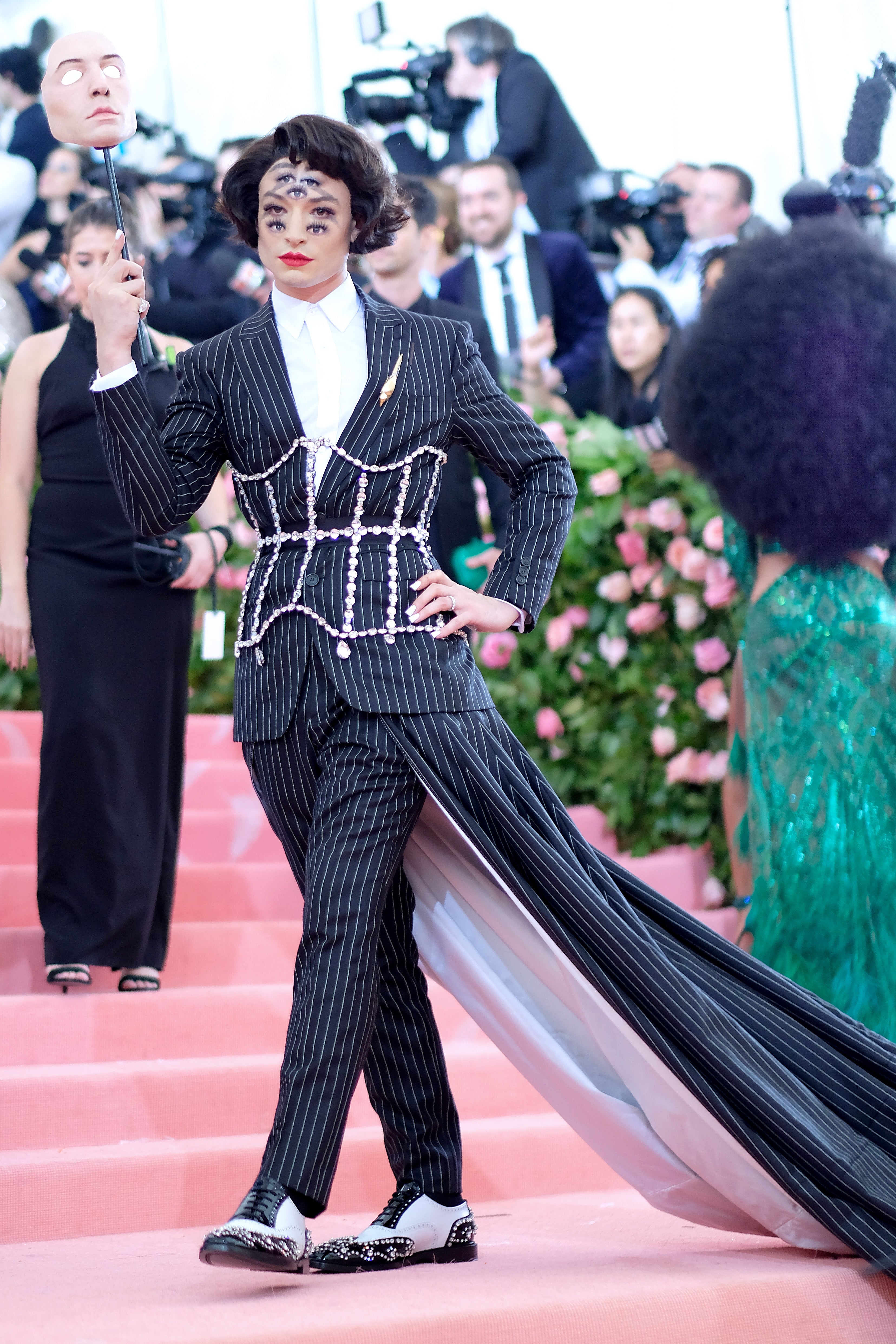 Ezra Miller donned a dizzying makeup look on the red carpet for the 2019 Met Gala, “Camp: Notes on Fashion”
