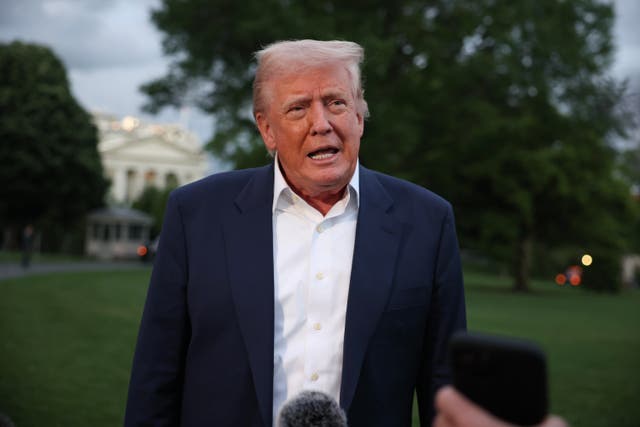 <p>US president Donald Trump speaks to reporters on the south lawn of the White House</p>
