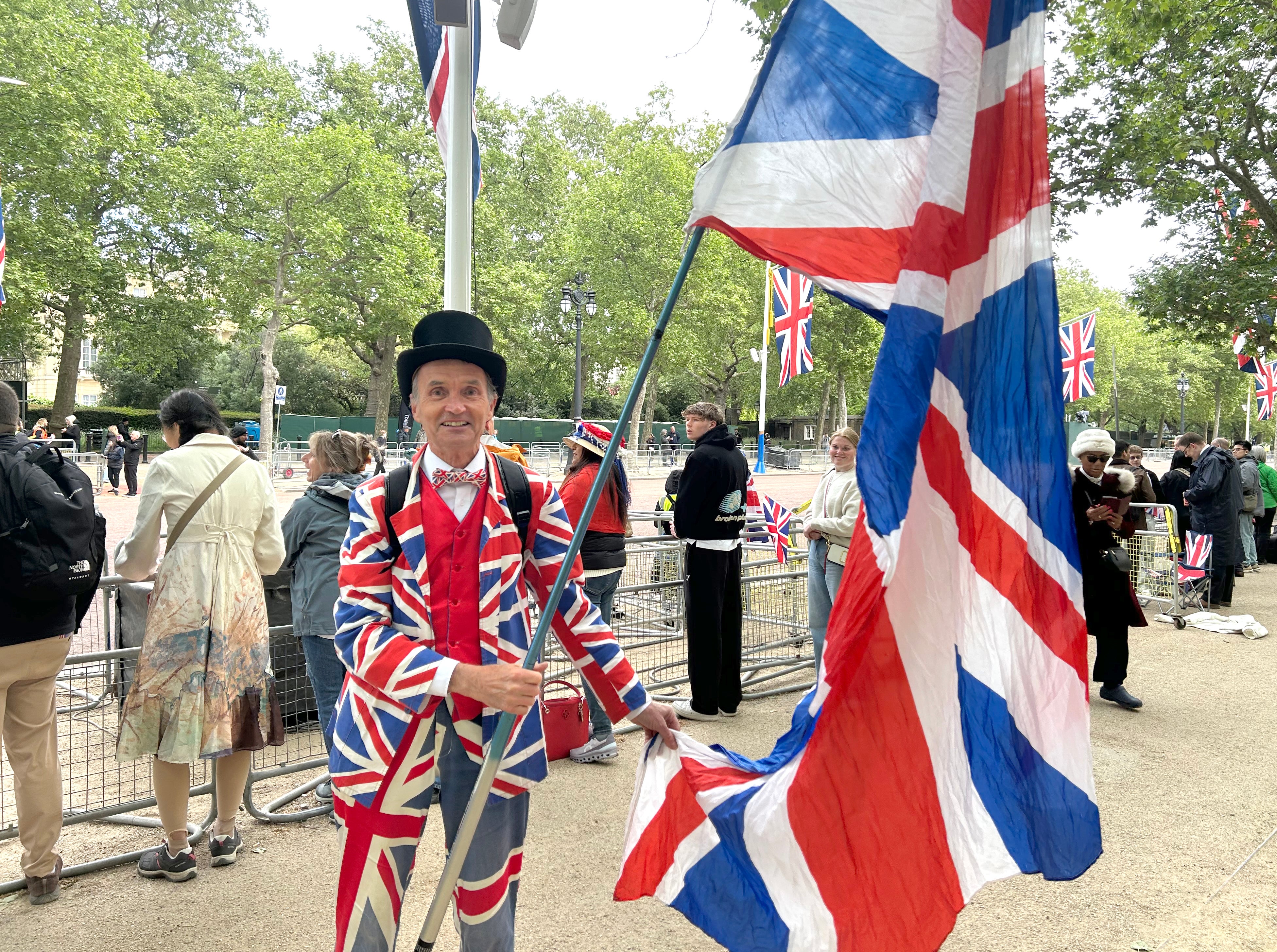 Michael Burn, 67, from Watford, is seen joining the crowds at The Mall outside Buckingham Palace