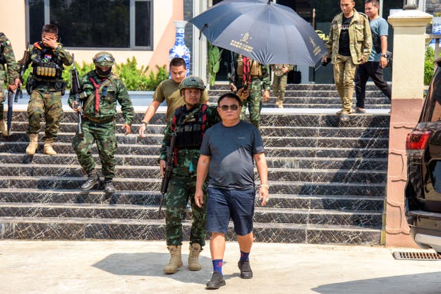 <p>Myanmar warlord Saw Chit Thu leaves after an interview with local media at Shwe Kokko city, a casino, entertainment and tourism complex in Myawaddy</p>