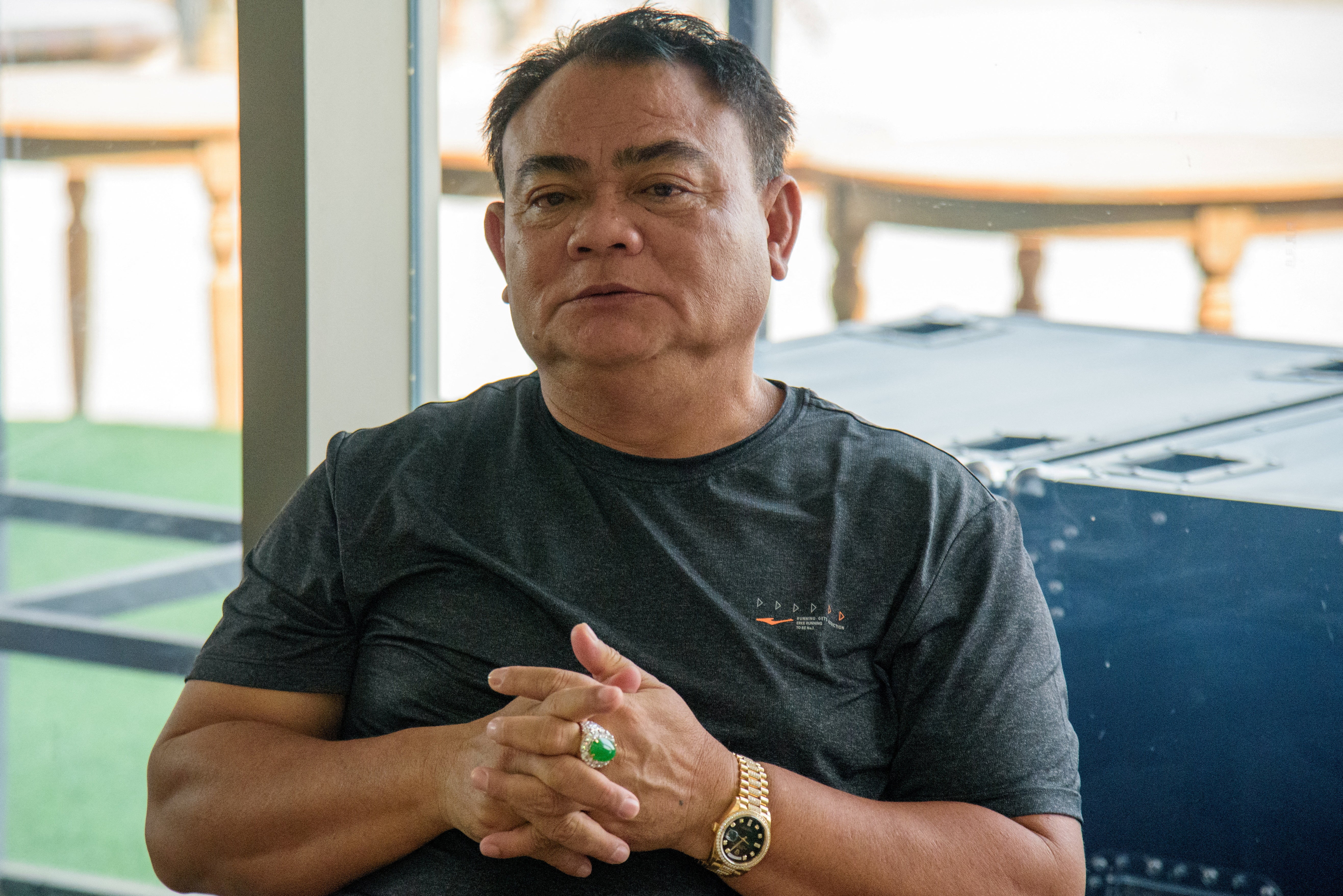 Myanmar warlord Saw Chit Thu is pictured during an interview with local media at Shwe Kokko city, a casino, entertainment and tourism complex in Myawaddy, Myanmar