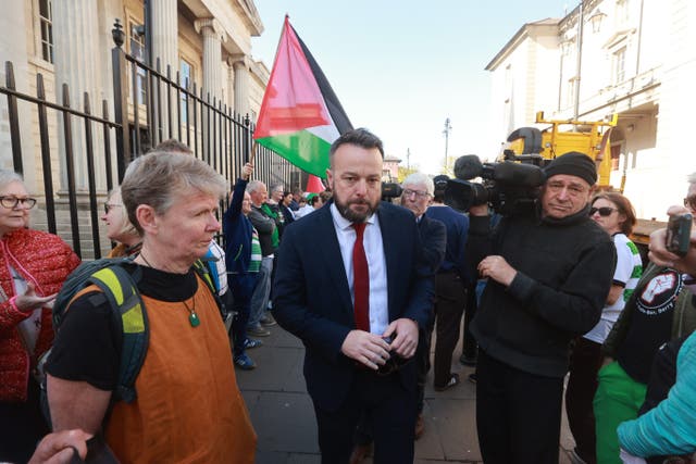 Former SDLP leader Colum Eastwood walks past supporters as he arrives at Derry Magistrates’ Court, where he is charged with taking part in an unnotified parade in Northern Ireland, in connection with a pro-Gaza rally that took place in Derry last February. Mr Eastwood is one of several people charged in relation to the event on February 14 last year. Picture date: Tuesday May 6, 2025.