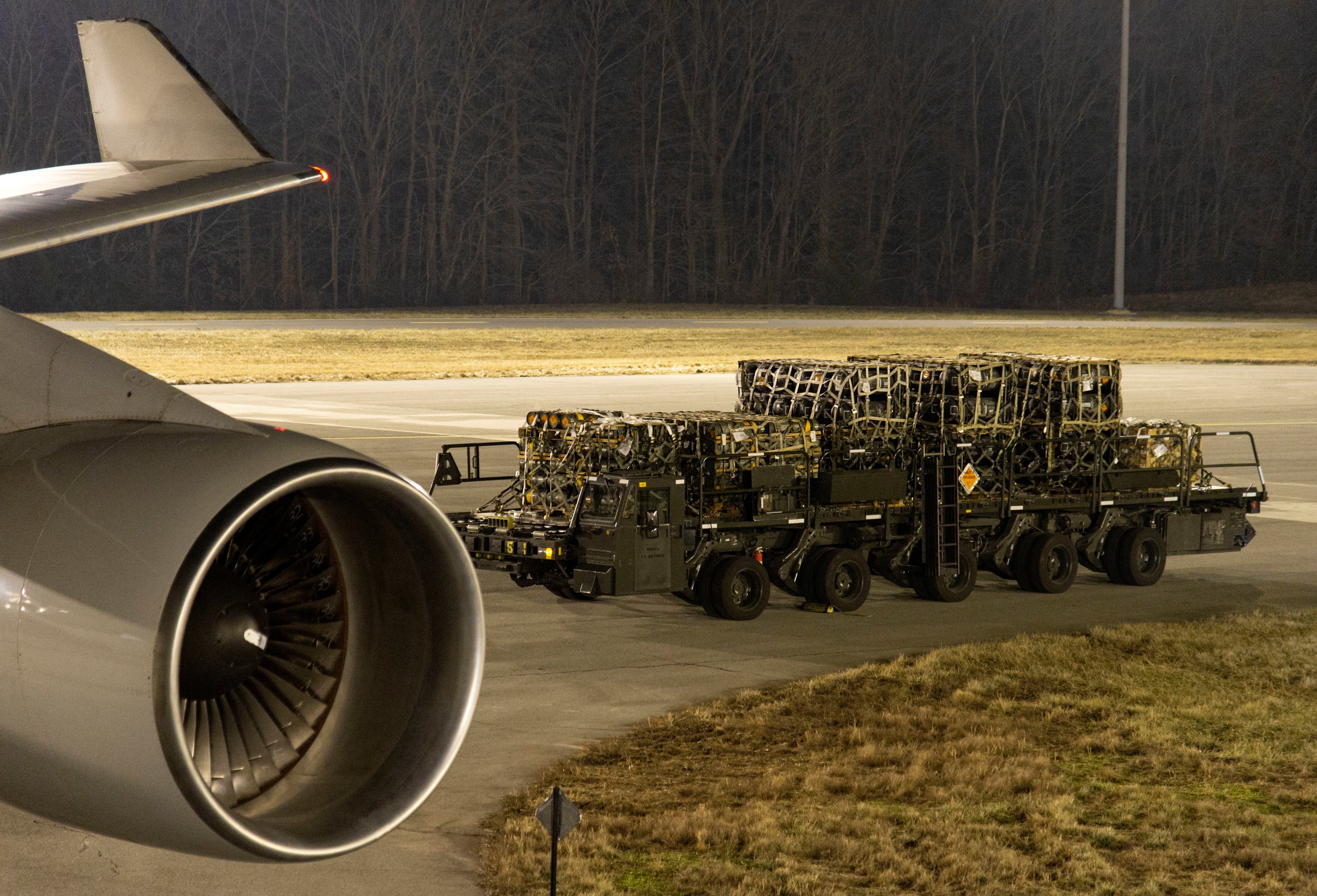Ammunition, weapons and other equipment bound for Ukraine is loaded on military aircraft at Dover Air Force Base on Delaware on January 24