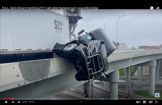 <p>A truck's cab hangs over the edge of Kennedy Bridge on Interstate 65 near Louisville, Kentucky, on Sunday May 4 2025</p>