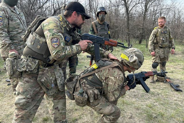 <p>Shawn McVey, former soldier in the US Army’s 25th Infantry Division (left), trains young recruits whose skills in gaming will be used to fly combat drones for the Ukrainians</p>