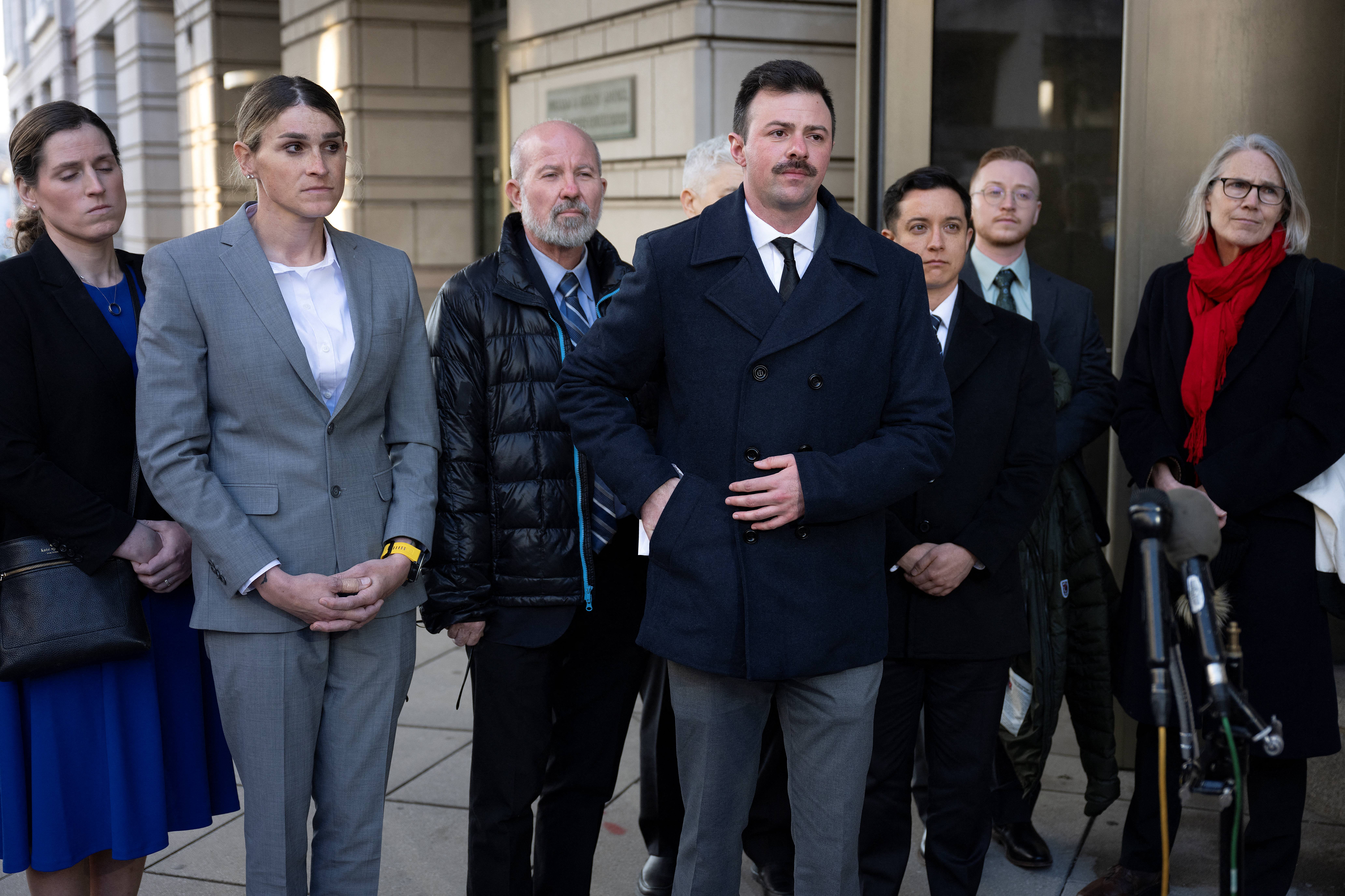 U.S Army Reserve 2nd Lt. Nicolas Talbott, center, is the lead plaintiff in one of two lawsuits from transgender service members seeking to overturn Trump’s executive order that effectively removes them from the military