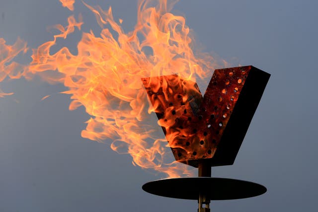 A flaming beacon at Dover Castle in Kent (PA)