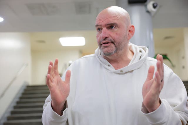 <p>U.S. Sen. John Fetterman (D-PA) speaks to reporters in the Senate Subway during a series of confirmation votes for U.S. President Donald Trump's cabinet nominees at the U.S. Capitol Building on February 12, 2025 in Washington, DC</p>