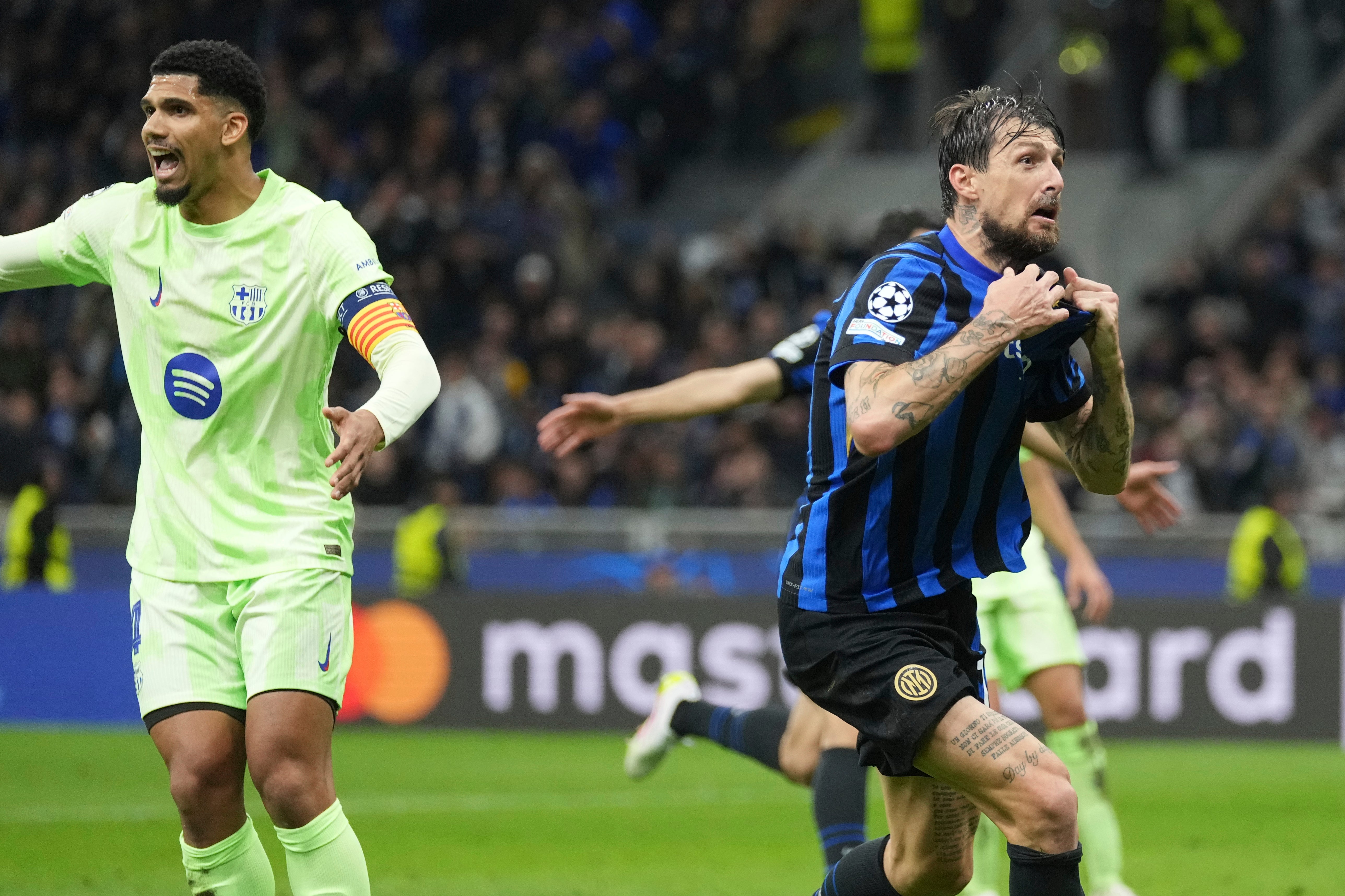 Francesco Acerbi celebrates after scoring Inter Milan’s stoppage-time equaliser against Barcelona (Antonio Calanni/AP)
