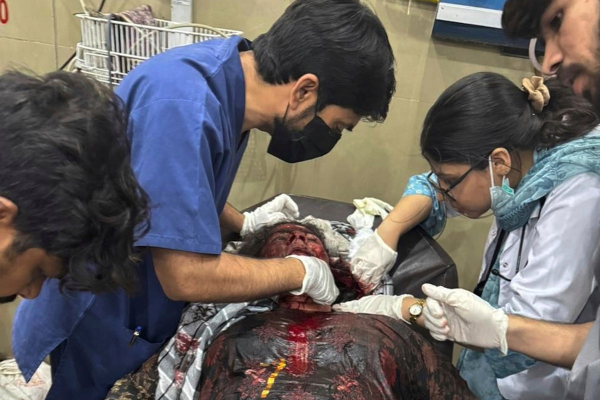 The Latest: India fires missiles across the border with Pakistan, killing at least 1, officials say