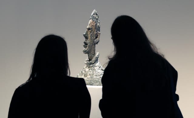 <p>Alberto Giacometti's 'Grande tête mince' on display during the press preview 2 May 2025 at Sotheby's New York</p>