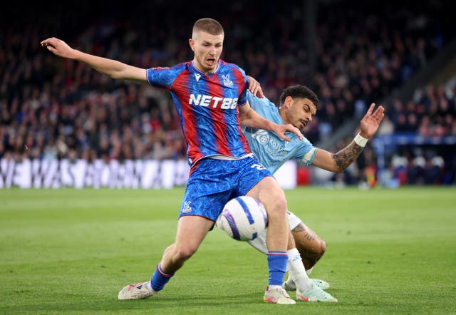 <p>Adam Wharton battles Morgan Gibbs-White for the ball</p>