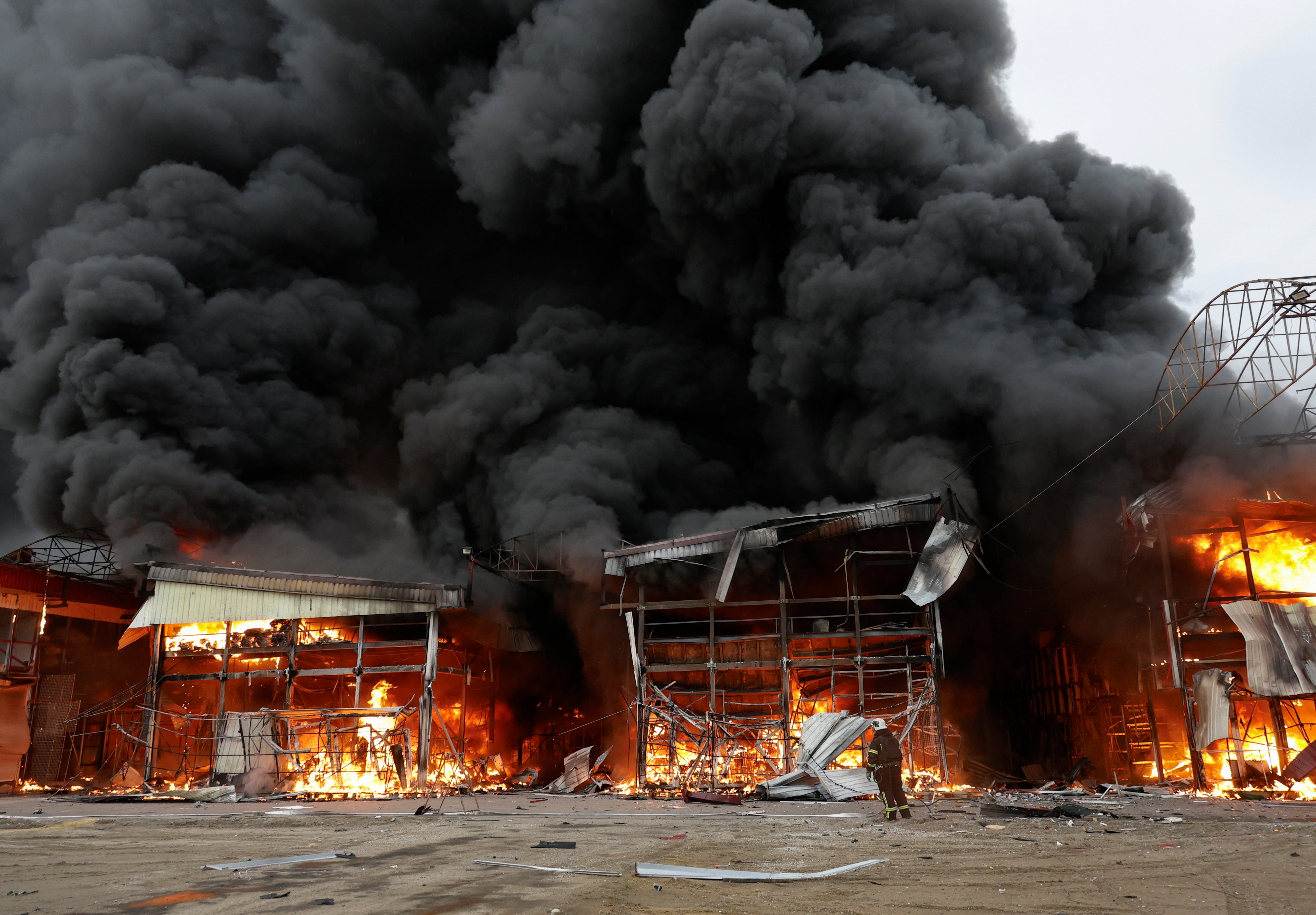 A market in Kharkiv, north-eastern Ukraine, was engulfed in flames following a Russian barrage of drones and missiles