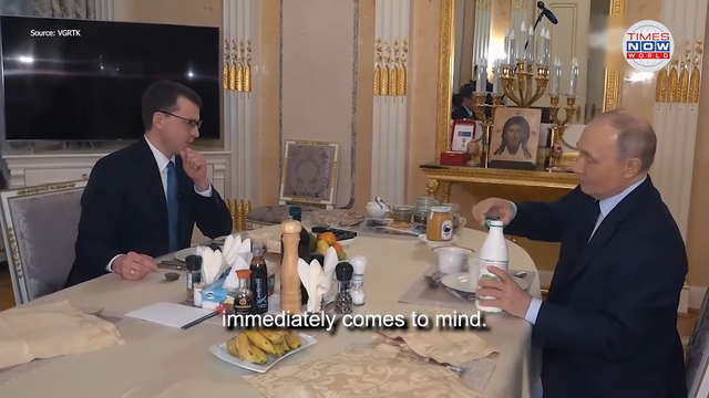 <p>Putin drinks kefir with a journalist inside his apartment</p>