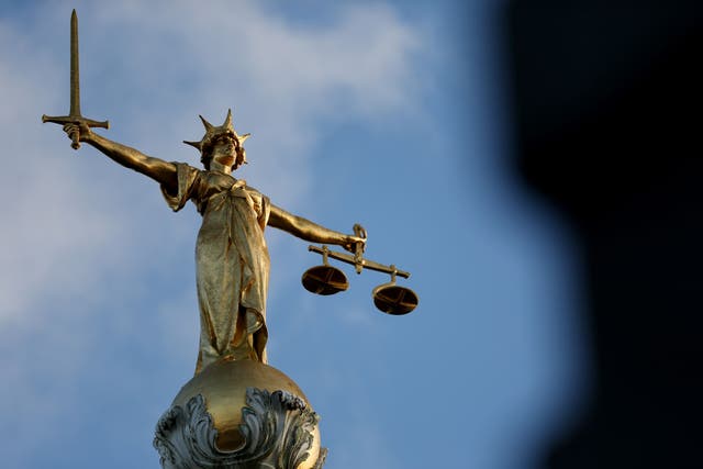 FW Pomeroy’s Statue of Justice stands atop the Central Criminal Court building, Old Bailey, London.