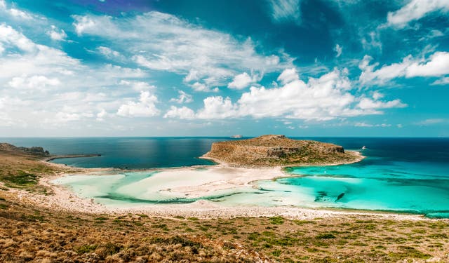 <p>The shallow turquoise waters and soft white sand of Balos lagoon in Crete is a perennial favourite with holidaymakers</p>