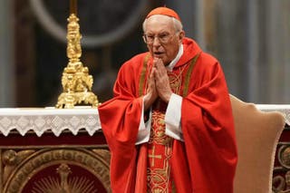 Cardinal Giovanni Battista Re leads a mass for the election of the Pope